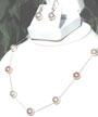 Large Round muli-colored cultured pearls on silk station necklace. 