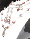 multi colored cultured pearls on station pearl necklace. Toggle clasp and coin pearl pendant.